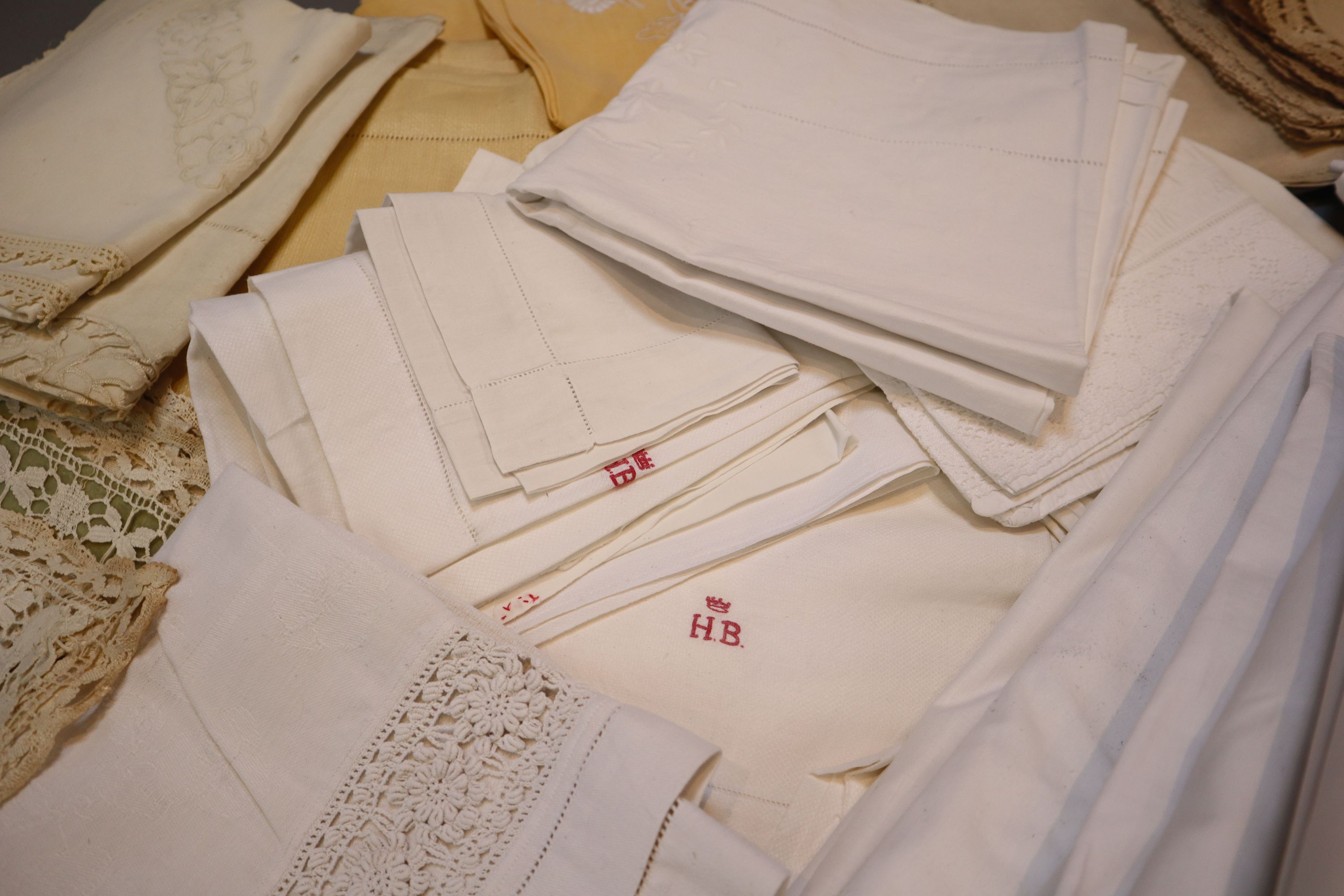 A quantity of linen sheets and embroidery